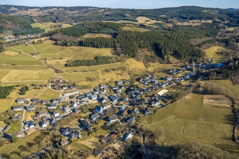Aerial view, residential area, view of Marmecke with St. Antonius Church, wooded area, hilly