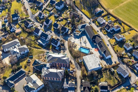 Aerial view, community primary school, below construction site with new building for new senior
