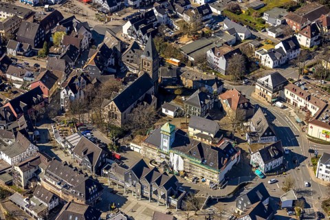 Aerial view, town hall in the old town building site with renovation and covered house facade with