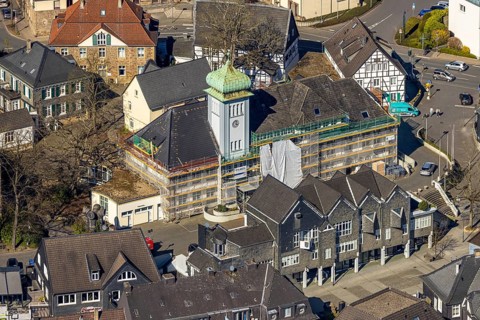 Aerial view, town hall in the old town centre construction site with renovation and covered house