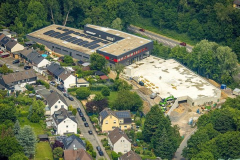 Aerial view, construction site new building Rewe supermarket Denkmalstraße, roof with solar panels,