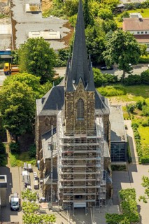 Aerial view, construction site catholic church St. Suitbertus with scaffolding on the church tower,