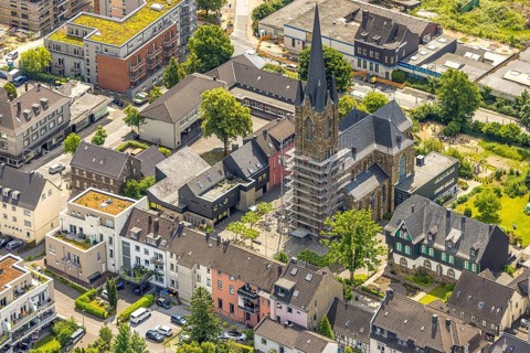 Aerial view, construction site catholic church St. Suitbertus with scaffolding on the church tower,