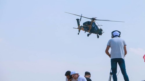 Turkish Air Force helicopters and fighter jets perform aerobatic maneuvers during Teknofest