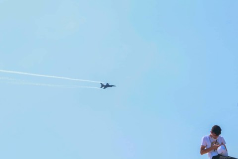Turkish Air Force helicopters and fighter jets perform aerobatic maneuvers during Teknofest