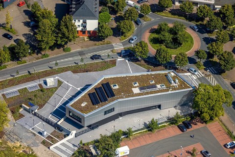 Aerial view, new integration house / health centre with café at the neighbourhood square in the