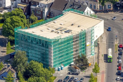 Aerial view, renovation of the municipal music school, construction site with scaffolding and