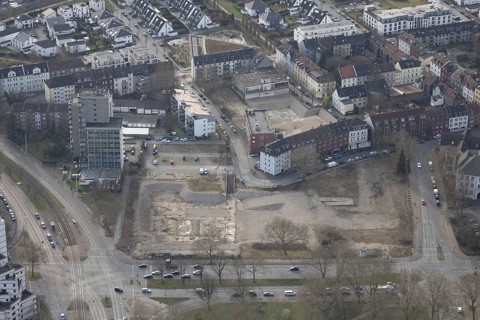 Aerial view, brownfield site of former central swimming pool, residential area and high-rise