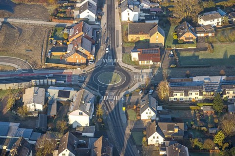 Aerial view, construction site roundabout at the planned local transport connection with stop in