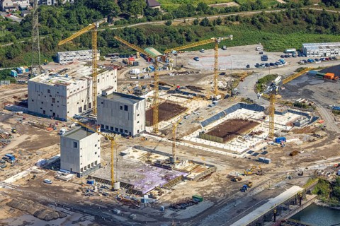 Aerial view, construction site with new construction of electrical switching houses for direct