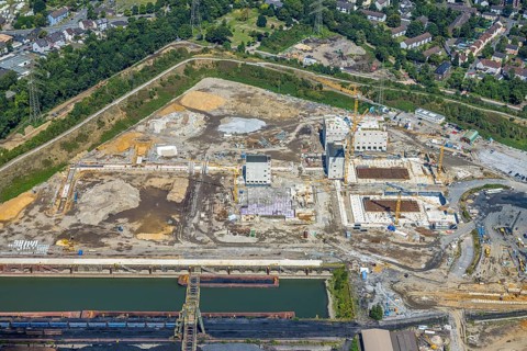 Aerial view, construction site with new construction of electrical switching houses for direct