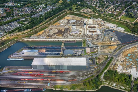 Aerial view, construction site with new construction of electrical switching houses for direct