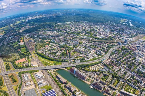 Aerial view, traffic jam on the A59 motorway with bridge over the inner harbour with city view,