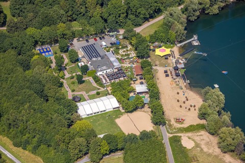 Aerial view, water skiing facility and leisure centre at Toeppersee, gastronomy with sunshades,