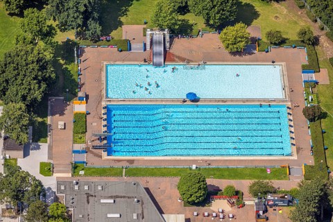 Aerial view, outdoor swimming pool Homberg with swimming pool and bathers, lifeguard with parasol