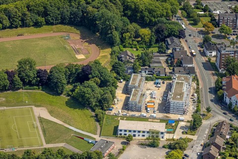 Aerial view, construction site on a former sports facility, residential area new construction and