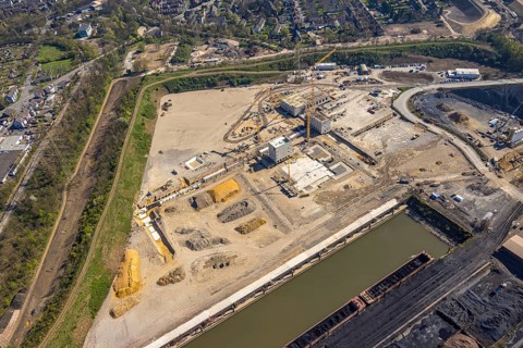 Aerial view, construction area with building site at the southern harbour, direct reduction plant