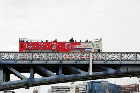 London, England, Great Britain, Europe, Red double-decker bus for city tours on a bridge