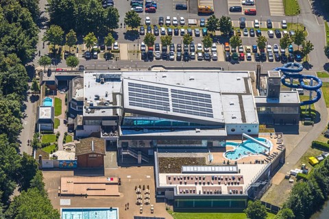 Aerial view, Olpe leisure pool, outdoor and indoor swimming pool with sun loungers and water slide,
