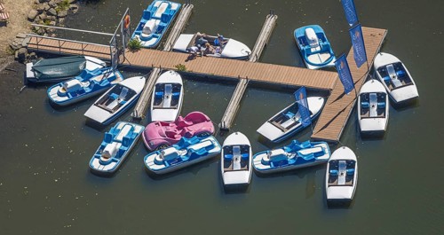 Aerial view, pedal boats at the landing stage at the Biggesee boathouse, people in the boat, shapes