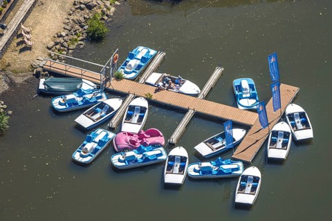 Aerial view, pedal boats at the landing stage at the Biggesee boathouse, people in the boat, shapes