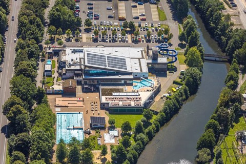 Aerial view, Olpe leisure pool, outdoor and indoor swimming pool with sun loungers and water slide,