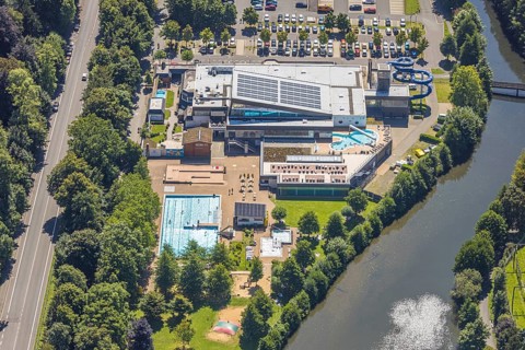 Aerial view, Olpe leisure pool, outdoor and indoor swimming pool with sun loungers and water slide,
