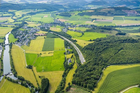 Aerial view, residential area district Olpe surrounded by meadows and fields, industrial area
