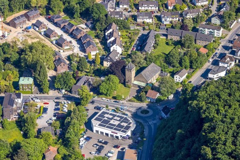 Aerial view, residential area at St Joseph's Church, Ford Kneifel car dealership with solar roof,