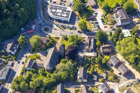Aerial view, residential area at St Joseph's Church, Ford Kneifel car dealership with solar roof,