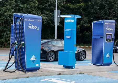 Charging stations with charging plugs at ARAl Pulse, Blankenfelde, 26/08/2025. A Tesla being