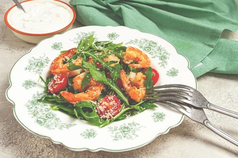 Shrimp salad with arugula and cherry tomatoes, with parmesan cheese, healthy food