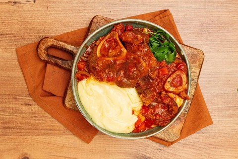 Ossobuco, stewed meat knuckle on the bone, with mashed potatoes, and oats and spices, homemade, no