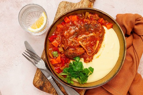 Ossobuco, stewed meat knuckle on the bone, with mashed potatoes, and oats and spices, homemade, no