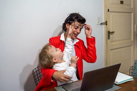 Authentic moment of a parent trying to focus on work