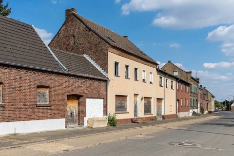Abandoned residential buildings with wooden sheds in Manheim, North Rhine-Westphalia