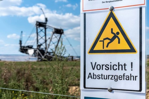 Warning sign Danger of falling in Hambach open-cast mine, Manheim, North Rhine-Westphalia, Germany