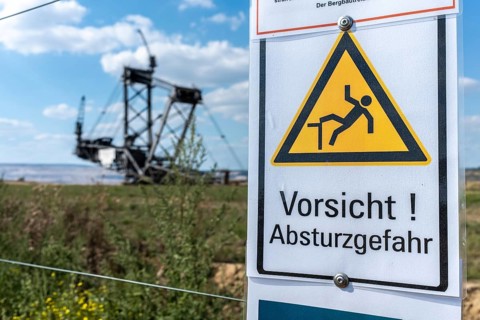 Warning sign Danger of falling in Hambach open-cast mine, Manheim, North Rhine-Westphalia, Germany