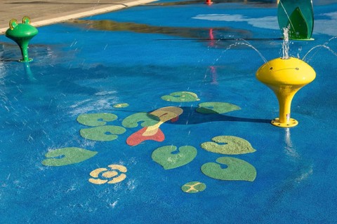 Yellow water play equipment with water lily motif