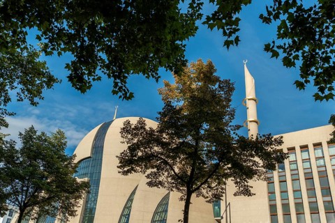 Mosque Cologne with minaret and trees