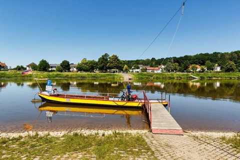 Cyclist on yaw rope ferry, passenger ferry on the Weser, from Herstelle to Würgassen, Beverungen,