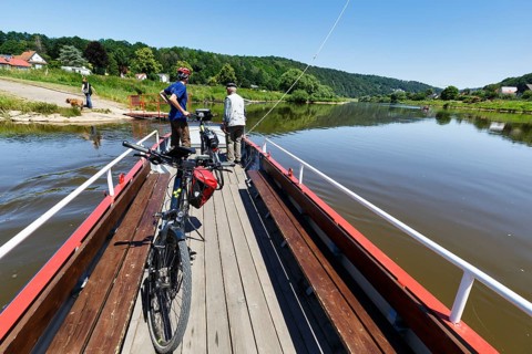 Cyclist on yaw rope ferry, passenger ferry on the Weser, from Herstelle to Würgassen, Beverungen,