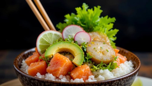 A close-up of a delicious poke bowl with salmon, avocado, radish, and lime. The chopsticks are