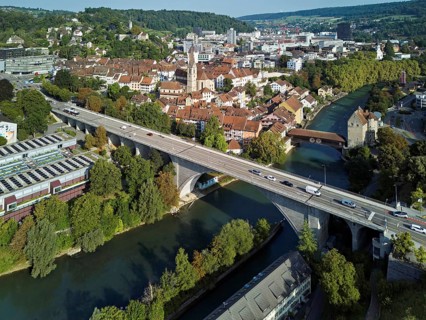 View of the old town, in front the high bridge, behind the covered wooden bridge with the
