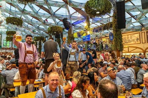 Visitors in the Hofbräu marquee at the Oktoberfest 2024 in Munich, Bavaria, Germany