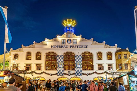 The Hofbräu marquee at Oktoberfest 2024 at dusk, Munich, Bavaria, Germany