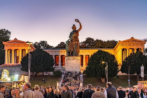 Ruhmeshalle, Bavaria statue and visitors at the Oktoberfest 2024 at dusk, Munich, Bavaria, Germany