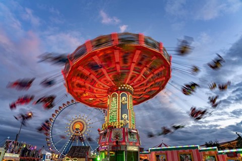 Chain carousel at Oktoberfest 2024 at dusk, Munich, Bavaria, Germany