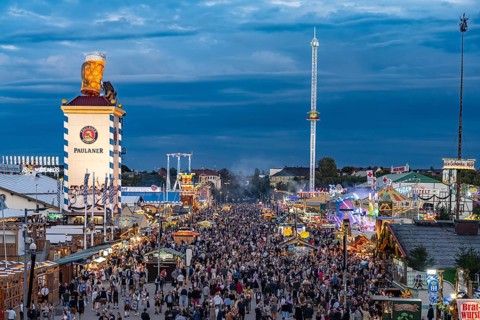 Visitors at the Oktoberfest 2024 seen from above at dusk, Munich, Bavaria, Germany