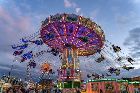Chain carousel at Oktoberfest 2024 at dusk, Munich, Bavaria, Germany